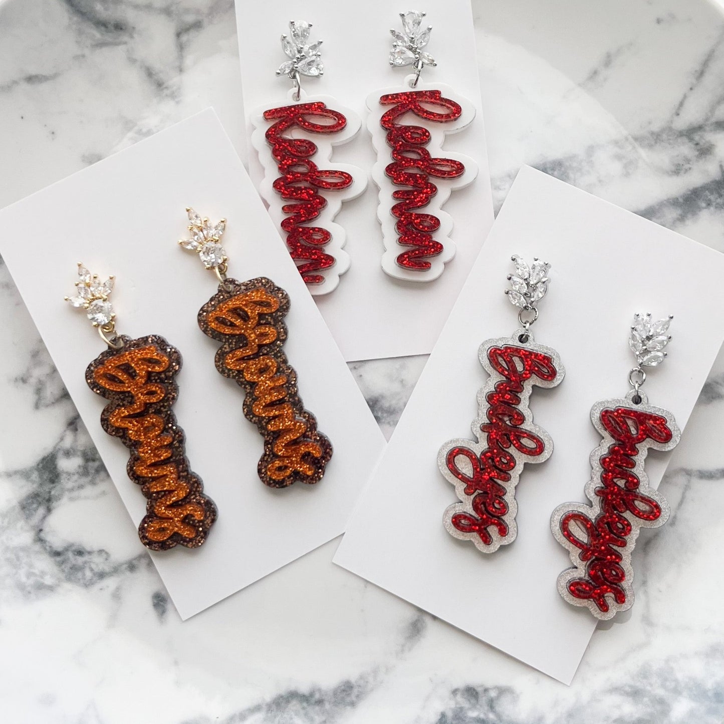 Cubic Zirconia Glitter Buckeyes Script Earrings